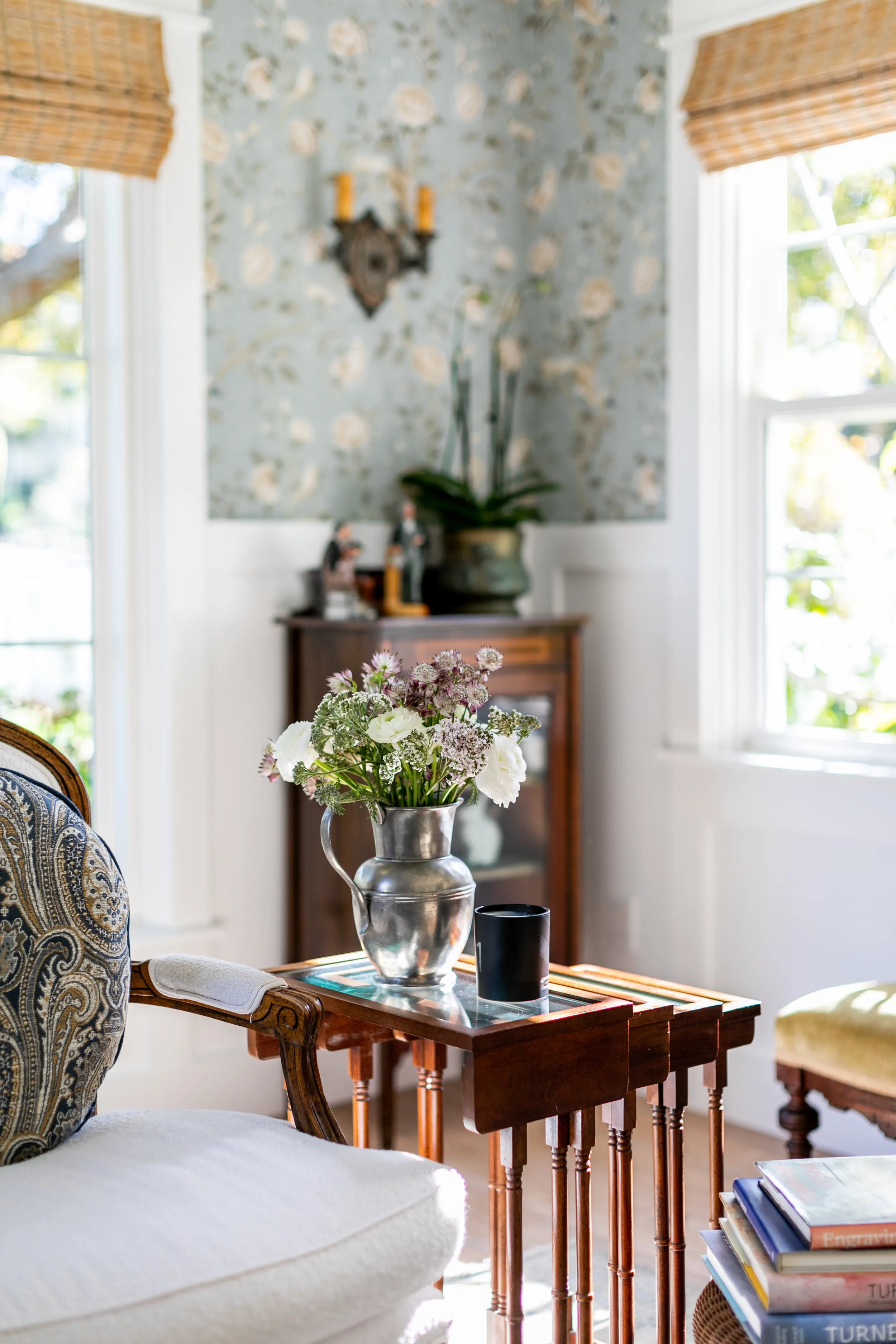 Library room chair and table with flowers